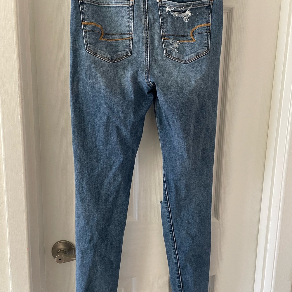 American Eagle NE(X)T LEVEL STRETCH light washes ripped‎ jeans. Size 4 long